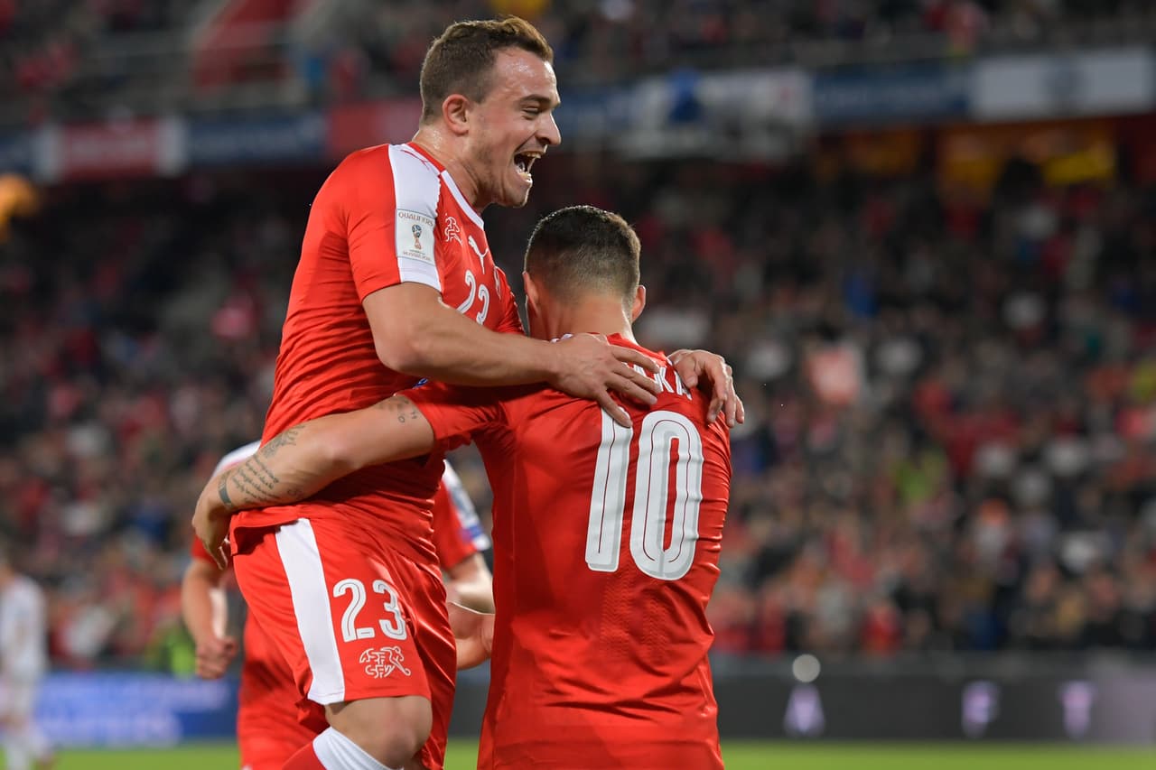 Swiss midfielder Xherdan Shaqiri (L) and Swiss midfielder Granit Xhaka celebrate a goal during the FIFA World Cup WC 2018 football qualifier match between Switzerland and Hungary at the St Jakob-Park Stadium on October 7, 2017 in Basel. / AFP PHOTO / Fabrice COFFRINI (Photo credit should read FABRICE COFFRINI/AFP/Getty Images)