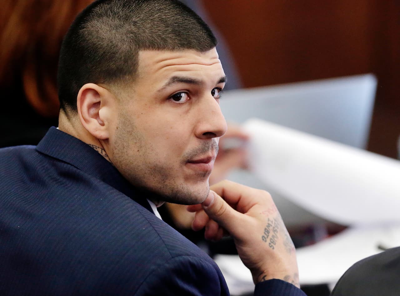 Defendant Aaron Hernandez listens during his double murder trial in Suffolk Superior Court, Wednesday, March 15, 2017, in Boston. Hernandez is on trial for the July 2012 killings of Daniel de Abreu and Safiro Furtado, who he encountered in a Boston nightclub. The former New England Patriots NFL football player is already serving a life sentence in the 2013 killing of semi-professional football player Odin Lloyd. (AP Photo/Elise Amendola, Pool)