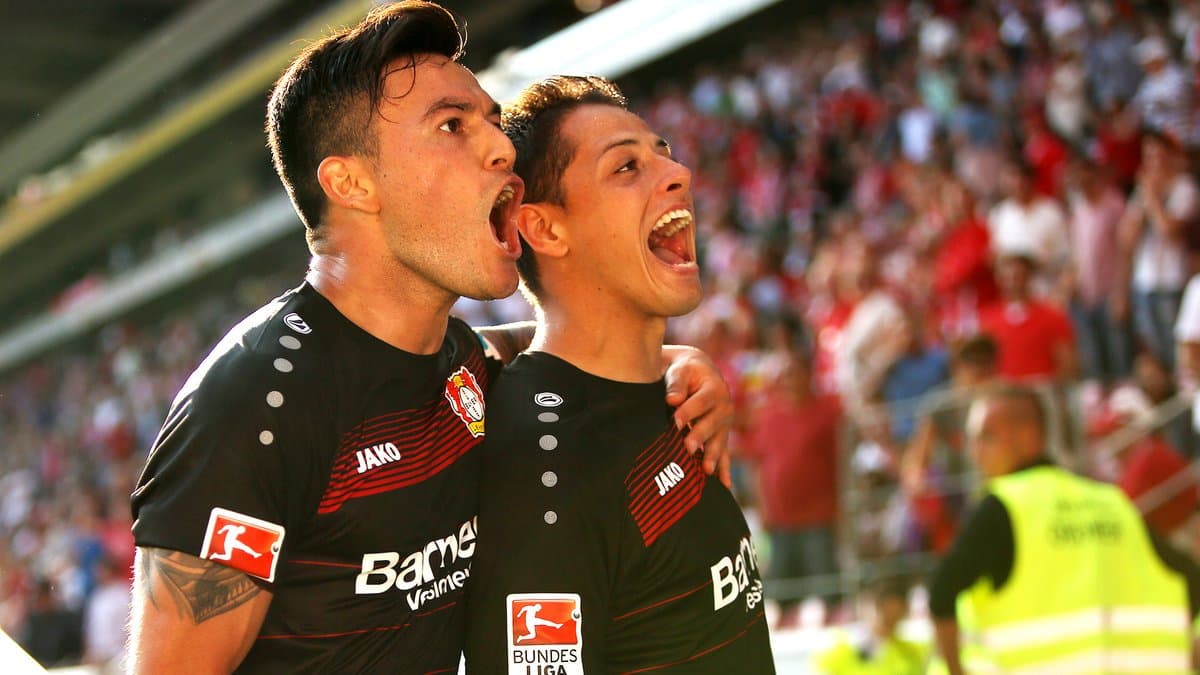 Leverkusen's Mexican striker Javier Hernandez celebrates after scoring during the German first division Bundesliga football match Bayer 04 Leverkusen vs Borussia Moenchengladbach in Leverkusen, western Germany, on December 12, 2015. / AFP / PATRIK STOLLARZ (Photo credit should read PATRIK STOLLARZ/AFP/Getty Images)