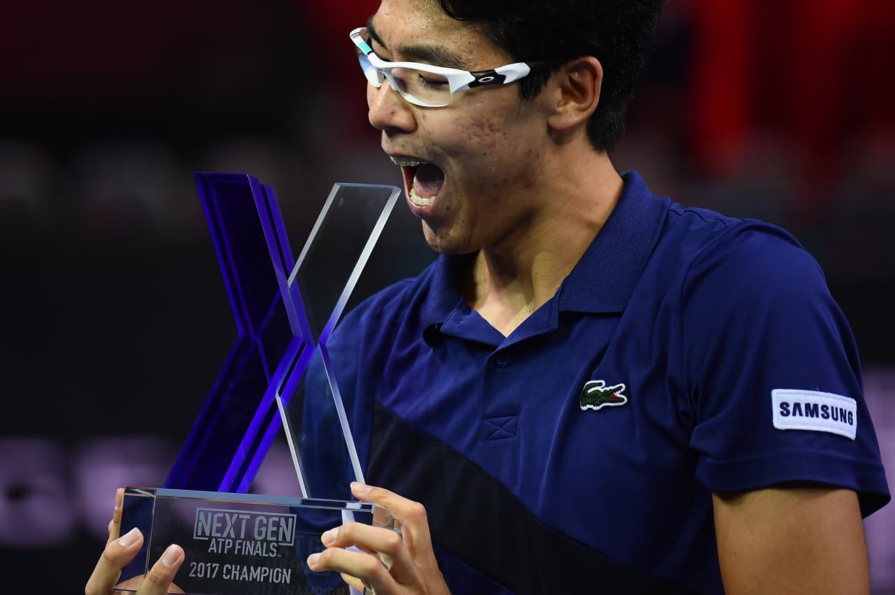 Hyeon Chung from South Korea celebrates after his victory in the men's singles tennis final match against Andrey Rublev from Russia during the first edition of the Next Generation ATP Finals in Milan on November 11, 2017, an annual men's youth tennis tournament organized by the Italian Tennis Federation and the Italian Olympic Committee. / AFP PHOTO / MARCO BERTORELLO (Photo credit should read MARCO BERTORELLO/AFP/Getty Images)