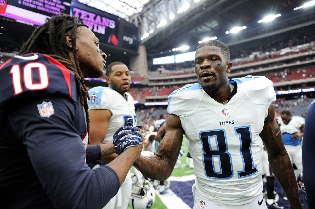 Houston Texans wide receiver DeAndre Hopkins (10) and Tennessee Titans wide receiver Andre Johnson (81) visit following an NFL football game, Sunday, Oct.2,2016, in Houston. (AP Photo/Eric Christian Smith)