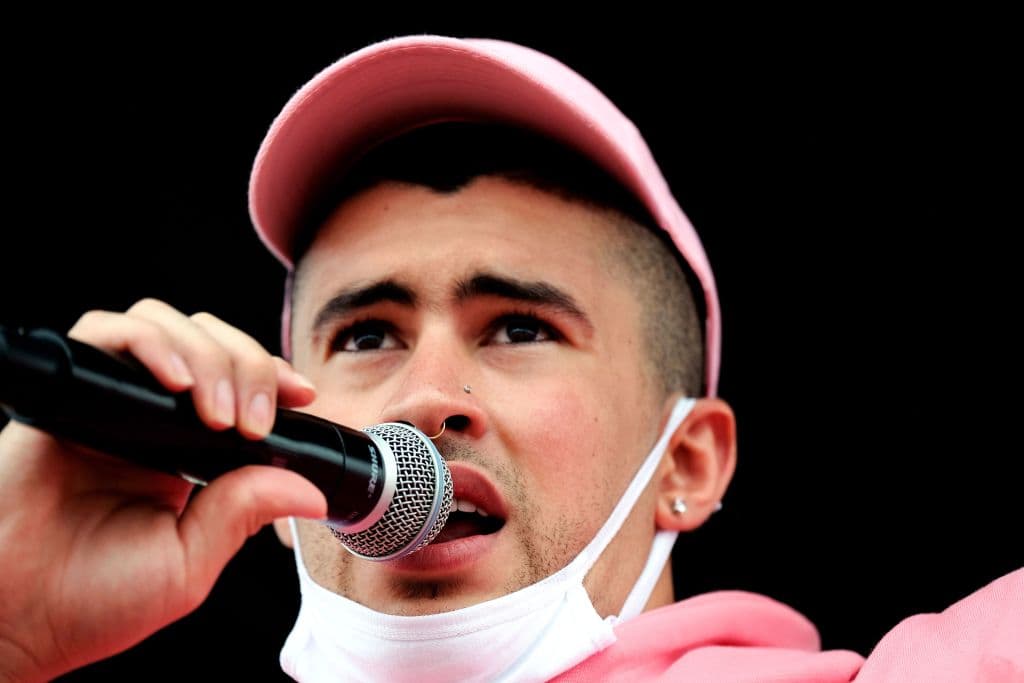 Puerto Rican rapper Bad Bunny participates in a march the day after the governor of Puerto Rico, Ricardo Rossello resigned from his charge in San Juan, on July 25, 2019. - Puerto Rico's embattled governor announced his resignation late July 24, following two weeks of massive protests triggered by the release of a text exchange in which he and others mocked gay people, women and hurricane victims. "I announce that I will be resigning from the governor's post effective Friday, August 2 at 5 pm," Rossello said, in a video statement posted on the government's Facebook page. (Photo by Ricardo ARDUENGO / AFP) (Photo credit should read RICARDO ARDUENGO/AFP via Getty Images)