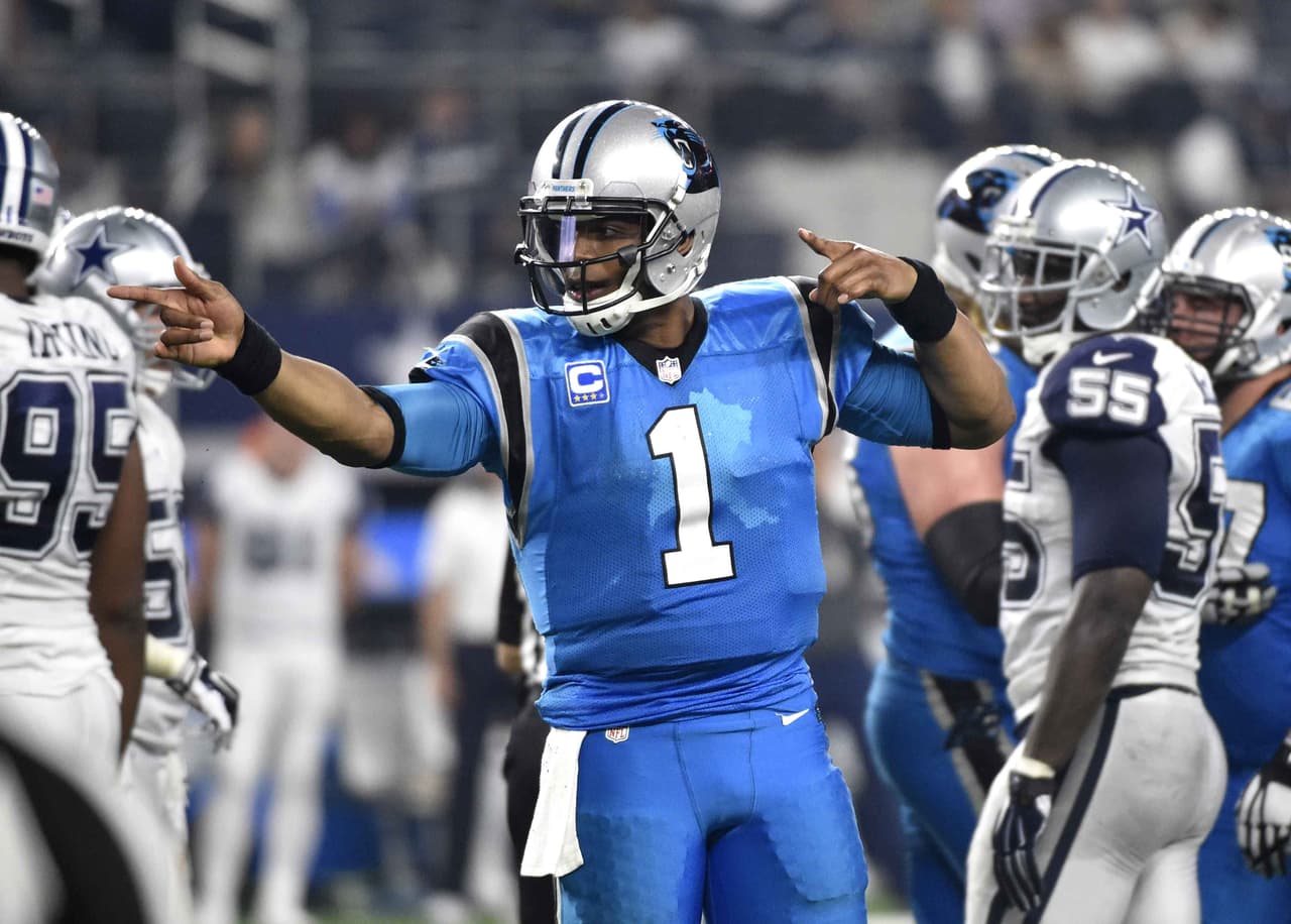 Cam Newton anotó una vez por tierra para llevar a los Panthers a mantener su invicto (11-0) tras vencer en Thanksgiving 33-14 a los Cowboys