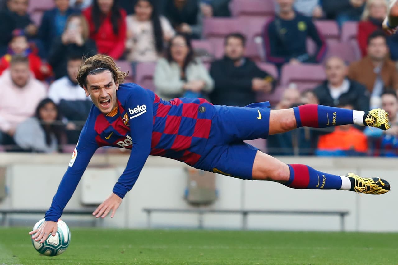 Barcelona's Antoine Griezmann falls during a Spanish La Liga soccer match between Barcelona and Eibar at the Camp Nou stadium in Barcelona, Spain, Saturday Feb. 22, 2020. (AP Photo/Joan Monfort)
