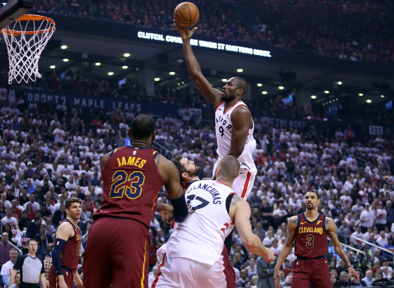 TORONTO, ON - MAY 01: Serge Ibaka #9 of the Toronto Raptors shoots the ball as Kevin Love #0 of the Cleveland Cavaliers defends in the first half of Game One of the Eastern Conference Semifinals during the 2018 NBA Playoffs at Air Canada Centre on May 1, 2018 in Toronto, Canada. NOTE TO USER: User expressly acknowledges and agrees that, by downloading and or using this photograph, User is consenting to the terms and conditions of the Getty Images License Agreement. (Photo by Vaughn Ridley/Getty Images)
