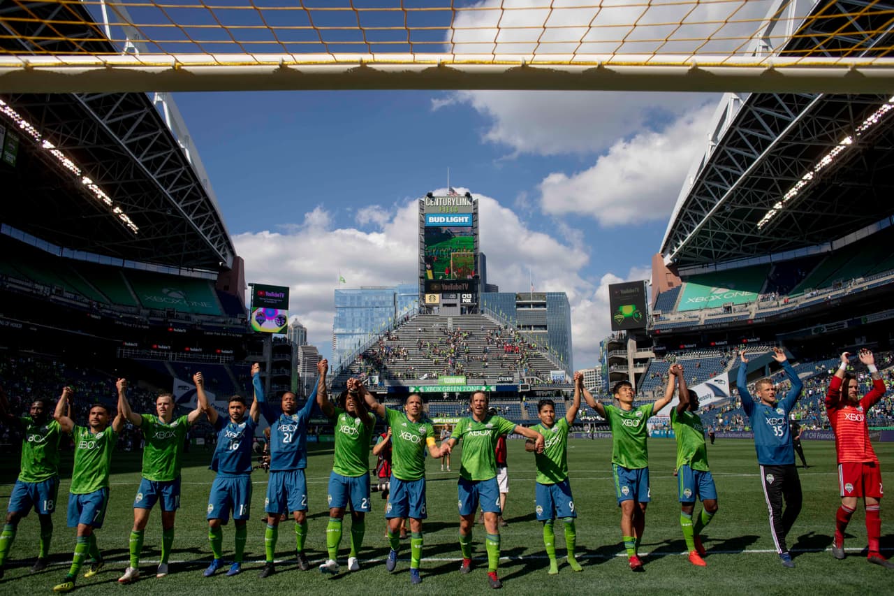 Sep 1, 2018; Seattle, WA, USA; The Seattle Sounders FC celebrate their 3-1 win over Sporting Kansas City at CenturyLink Field. Mandatory Credit: Jennifer Buchanan-USA TODAY Sports