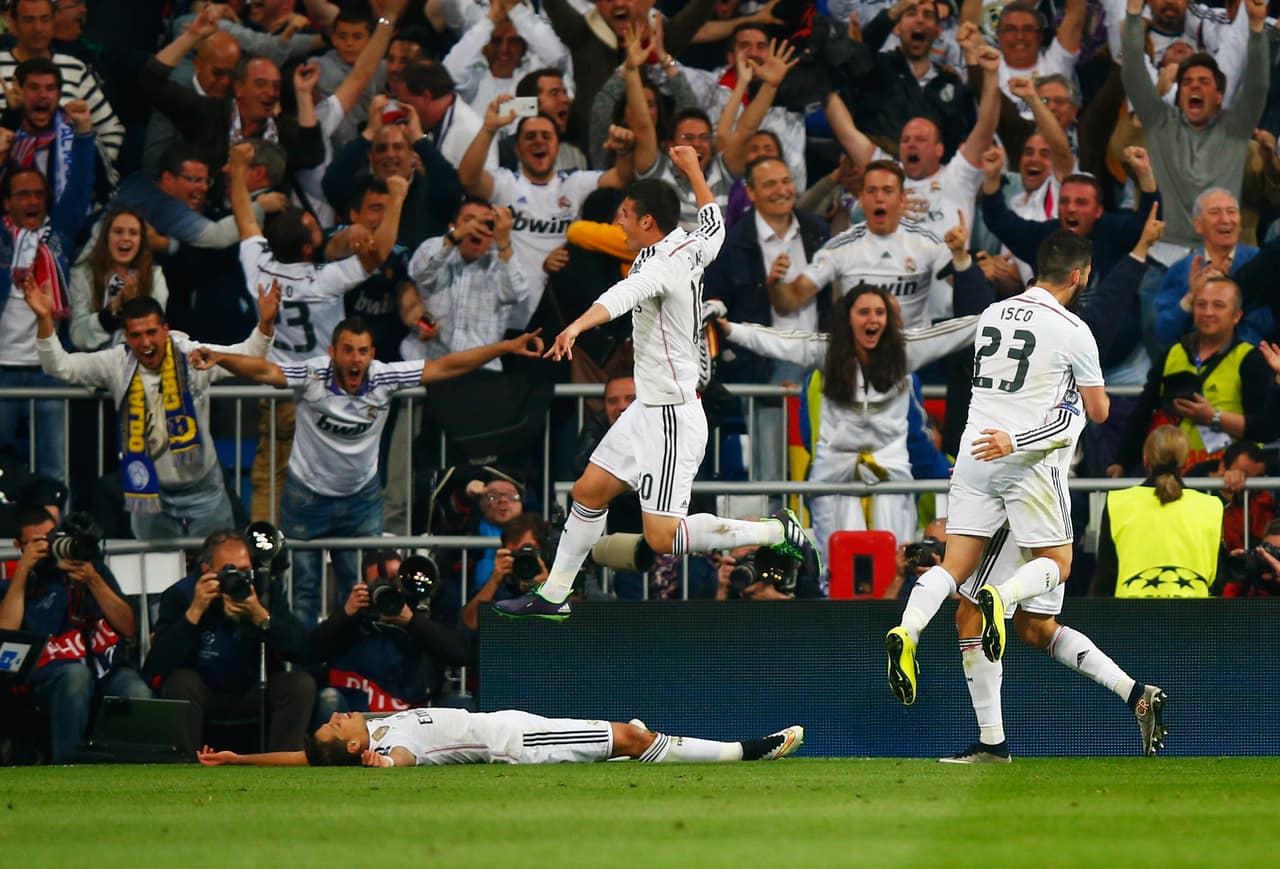 MADRID, SPAIN - APRIL 22: Javier Hernandez of Real Madrid CF (L) celebrates with fans and team mates as he scores their first goal during the UEFA Champions League quarter-final second leg match between Real Madrid CF and Club Atletico de Madrid at Bernabeu on April 22, 2015 in Madrid, Spain. (Photo by Clive Rose/Getty Images)