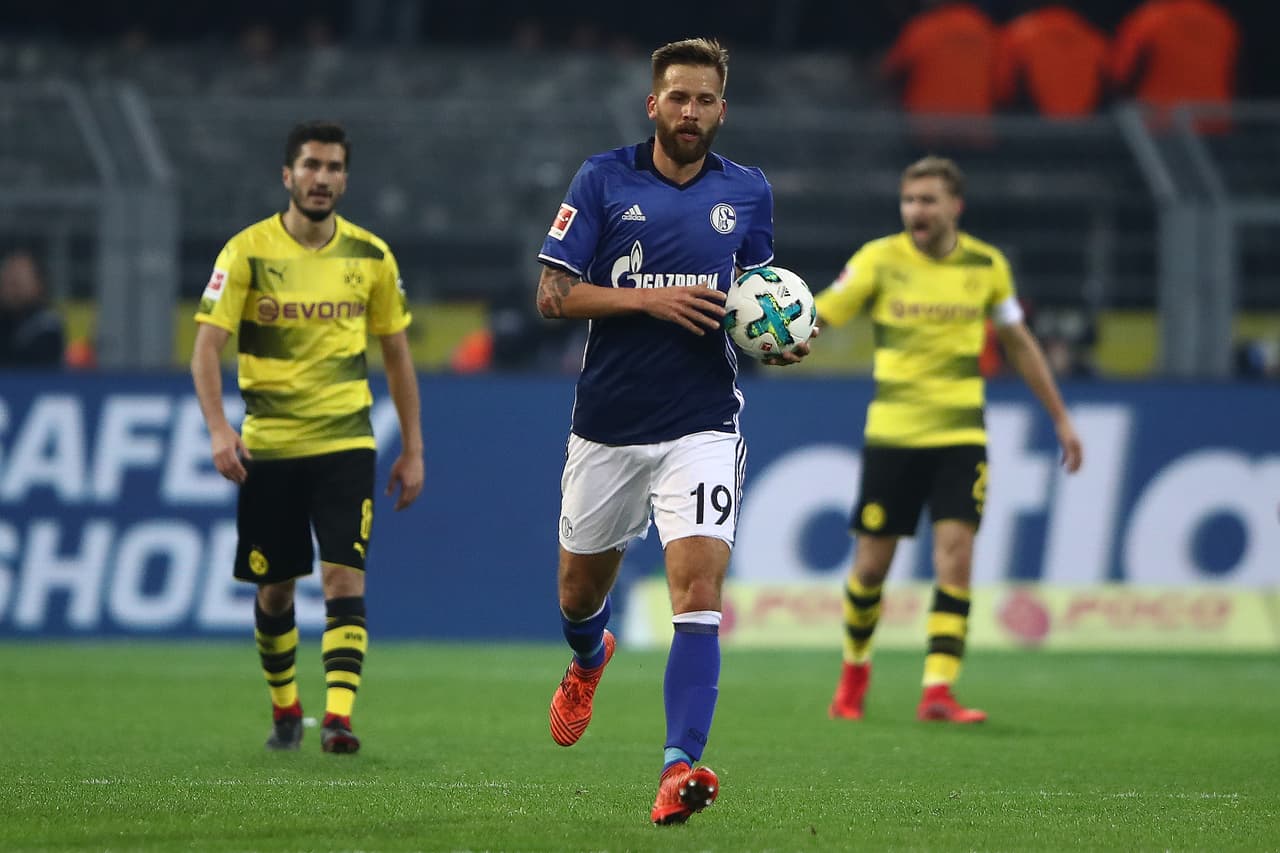 DORTMUND, GERMANY - NOVEMBER 25: Guido Burgstaller of Schalke carries the ball after he scored a goal to make it 1:4 during the Bundesliga match between Borussia Dortmund and FC Schalke 04 at Signal Iduna Park on November 25, 2017 in Dortmund, Germany. (Photo by Alex Grimm/Bongarts/Getty Images)