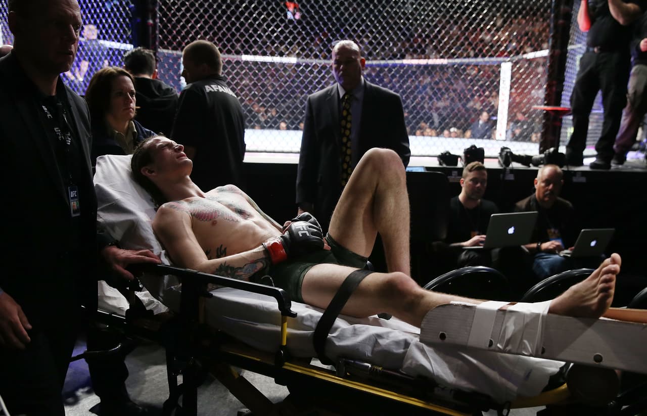 LAS VEGAS, NV - MARCH 03: Sean O'Malley leaves the arena on a stretcher after injuring his lower right leg during a bantamweight bout against Andre Soukhamthath during UFC 222 at T-Mobile Arena on March 3, 2018 in Las Vegas, Nevada. (Photo by Isaac Brekken/Getty Images)