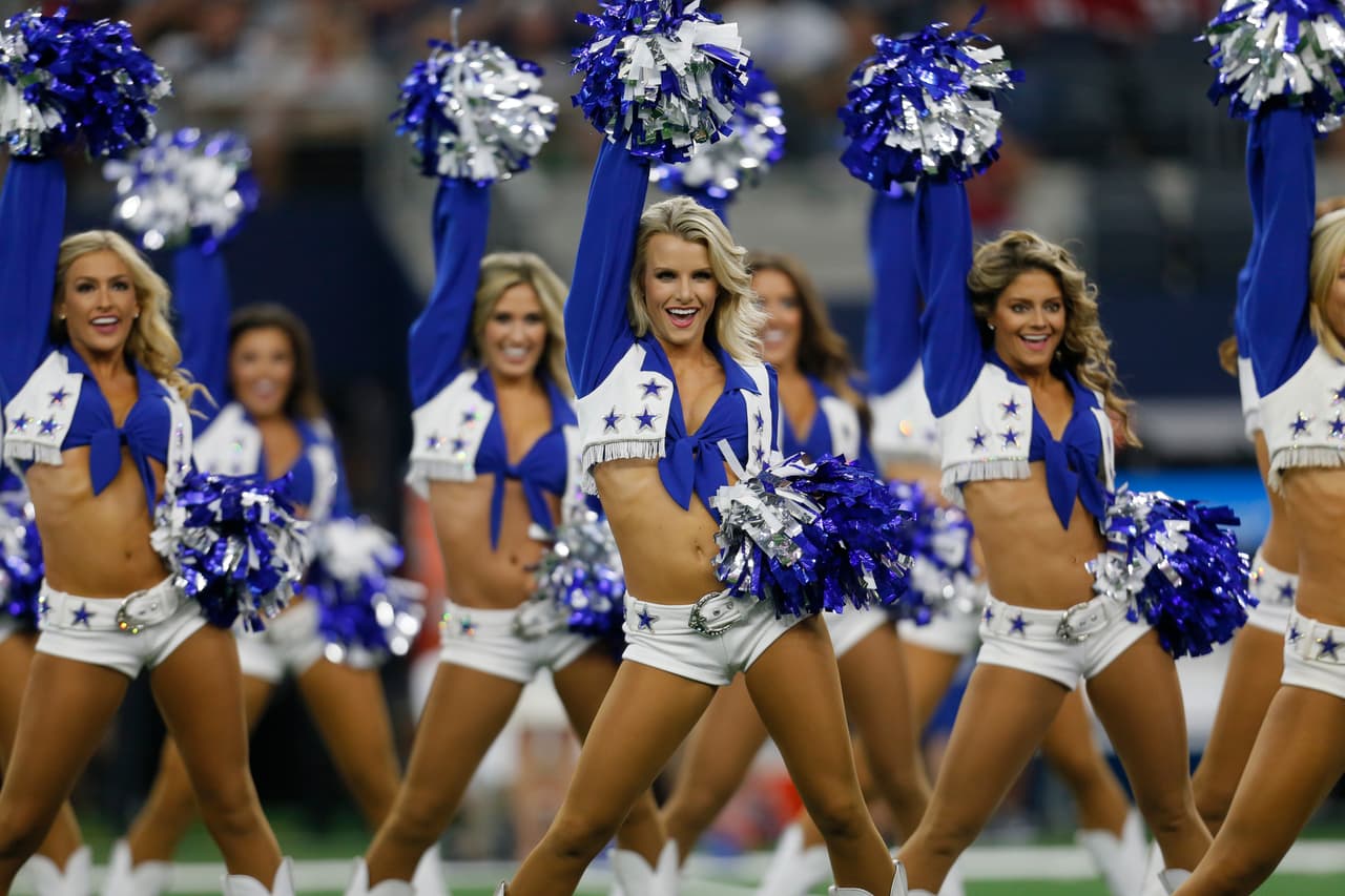 Dallas Cowboys cheerleaders perform during the first half of a preseason NFL football game against the Arizona Cardinals in Arlington, Texas, Sunday, Aug. 26, 2018. (AP Photo/Roger Steinman)