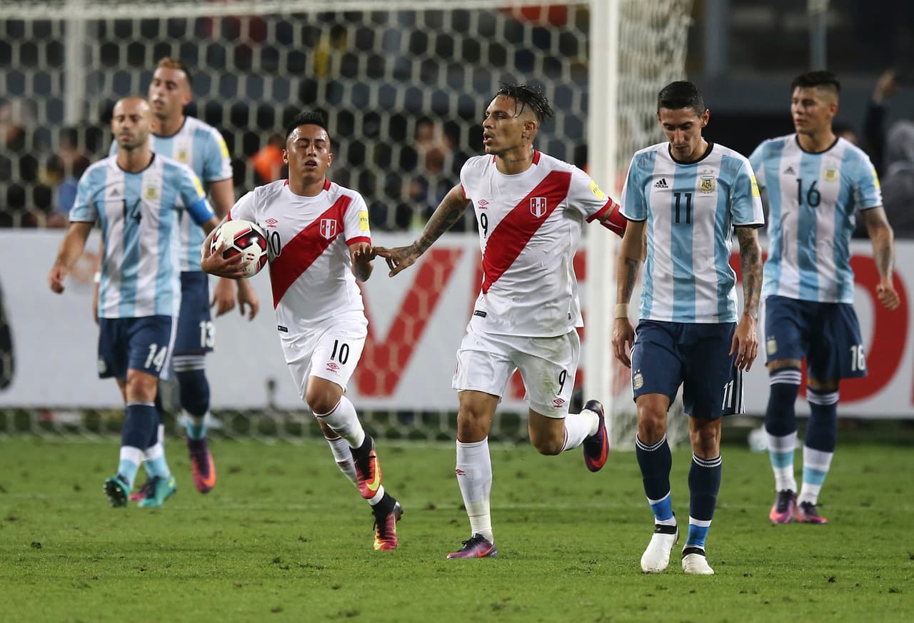 LIMA, PERU - OCTOBER 06: Christian Cueva of Peru celebrates with teammate Paolo Guerrero after scoring his team's second goal during a match between Peru and Argentina as part of FIFA 2018 World Cup Qualifiers at Nacional Stadium on October 06, 2016 in Lima, Peru. (Photo by Daniel Apuy/LatinContent/Getty Images)