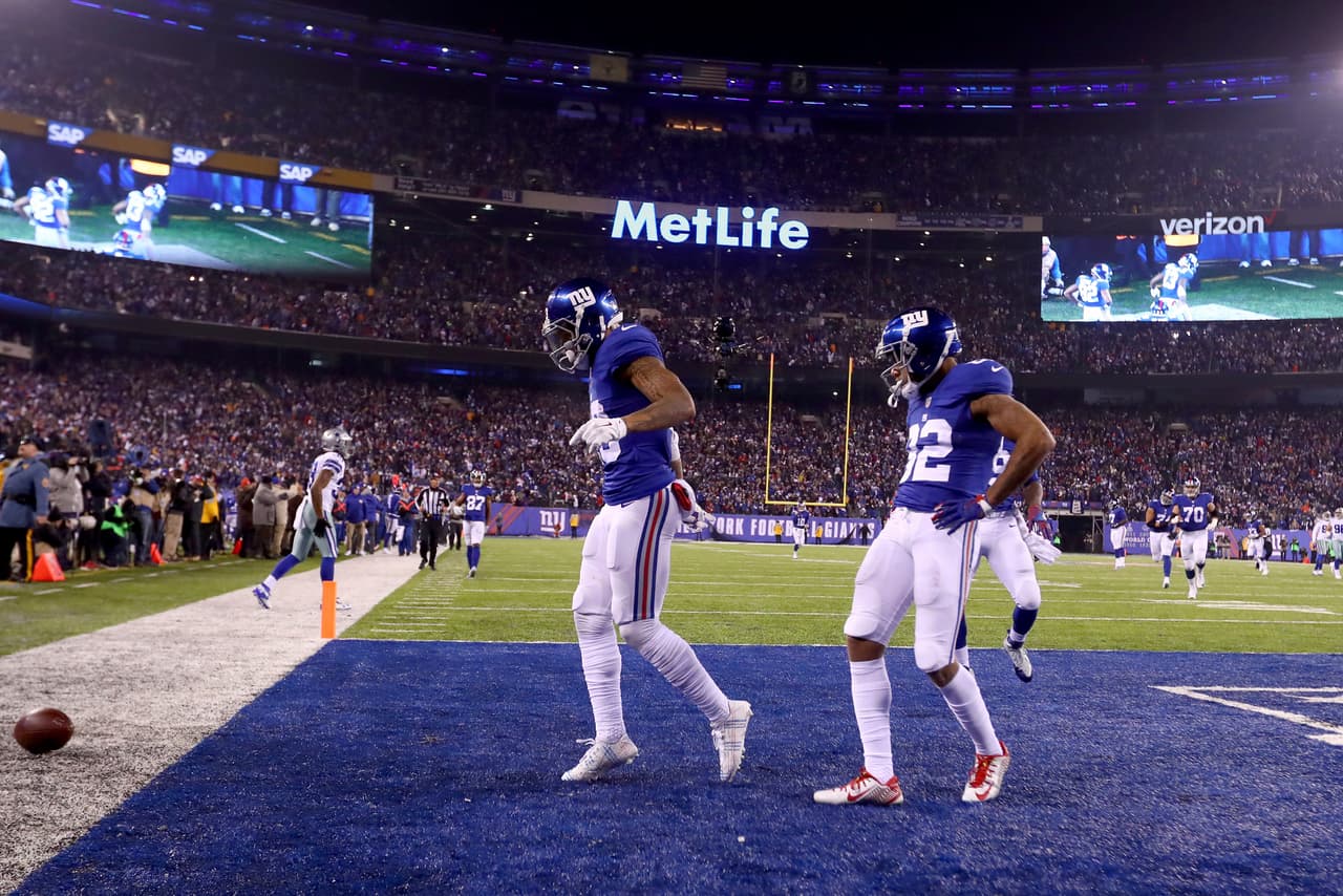 EAST RUTHERFORD, NJ - DECEMBER 11: Odell Beckham Jr. #13 of the New York Giants celebrates with his teammates after scoring a 61 yard touchdown against the Dallas Cowboys during the third quarter of the game at MetLife Stadium on December 11, 2016 in East Rutherford, New Jersey. (Photo by Al Bello/Getty Images)