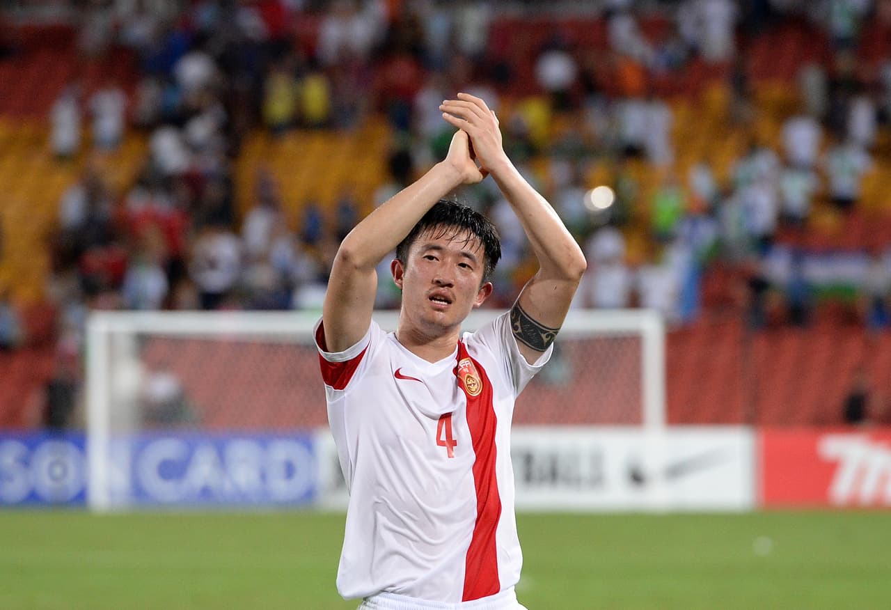 BRISBANE, AUSTRALIA - JANUARY 14: Jiang Zhipeng of China celebrates victory after the 2015 Asian Cup match between China PR and Uzbekistan at Suncorp Stadium on January 14, 2015 in Brisbane, Australia. (Photo by Bradley Kanaris/Getty Images)