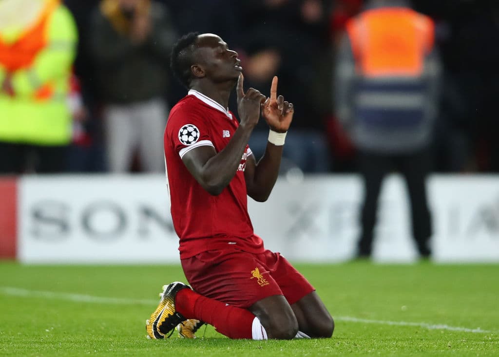 LIVERPOOL, ENGLAND - APRIL 24: Sadio Mane of Liverpool celebrates after scoring his sides third goal during the UEFA Champions League Semi Final First Leg match between Liverpool and A.S. Roma at Anfield on April 24, 2018 in Liverpool, United Kingdom. (Photo by Clive Brunskill/Getty Images)