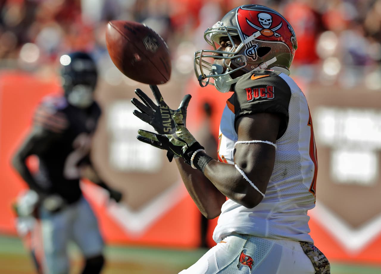 La concentración del receptor de Tampa, Freddie Martino, para atrapar este pase y lograr la anotación.