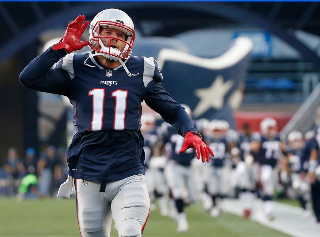 New England Patriots wide receiver Julian Edelman runs onto the field for an NFL preseason football game against the Jacksonville Jaguars, Thursday, Aug. 10, 2017, in Foxborough, Mass. (AP Photo/Mary Schwalm)