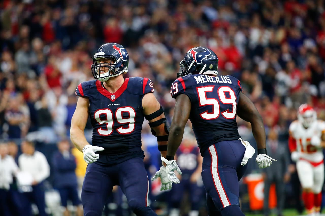Houston Texans linebacker Whitney Mercilus (59) and defensive end J.J. Watt (99) celebrate after a play during a Wild Card week NFL game against the Kansas City Chiefs on Saturday, Jan. 9, 2016, in Houston. The Chiefs won the game 30-0. (Matt Patterson via AP)