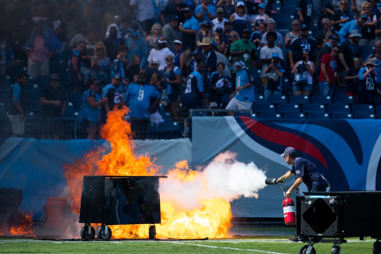 NASHVILLE, TN - SEPTEMBER 15: A failed pyrotechnic device bursts into flames before the game between the Tennessee Titans and the Indianapolis Colts at Nissan Stadium on September 15, 2019 in Nashville, Tennessee. (Photo by Brett Carlsen/Getty Images)
