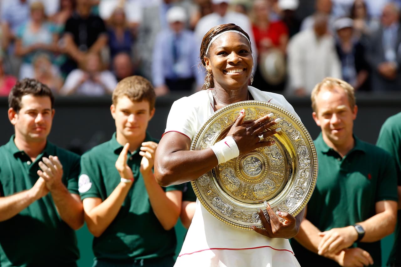 LONDON, ENGLAND - JULY 03: Serena Williams of USA holds the Championship trophy after winning her Ladies Singles Final Match against Vera Zvonareva of Russia on Day Twelve of the Wimbledon Lawn Tennis Championships at the All England Lawn Tennis and Croquet Club on July 3, 2010 in London, England. (Photo by Matthew Stockman/Getty Images)