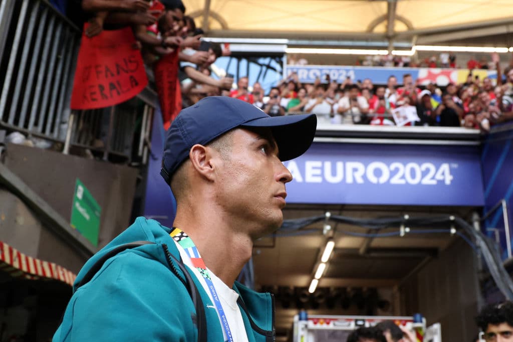 GELSENKIRCHEN, GERMANY - JUNE 26: Cristiano Ronaldo of Portugal looks on as fans react as he arrives at the stadium prior to the UEFA EURO 2024 group stage match between Georgia and Portugal at Arena AufSchalke on June 26, 2024 in Gelsenkirchen, Germany. (Photo by Kevin C. Cox/Getty Images)