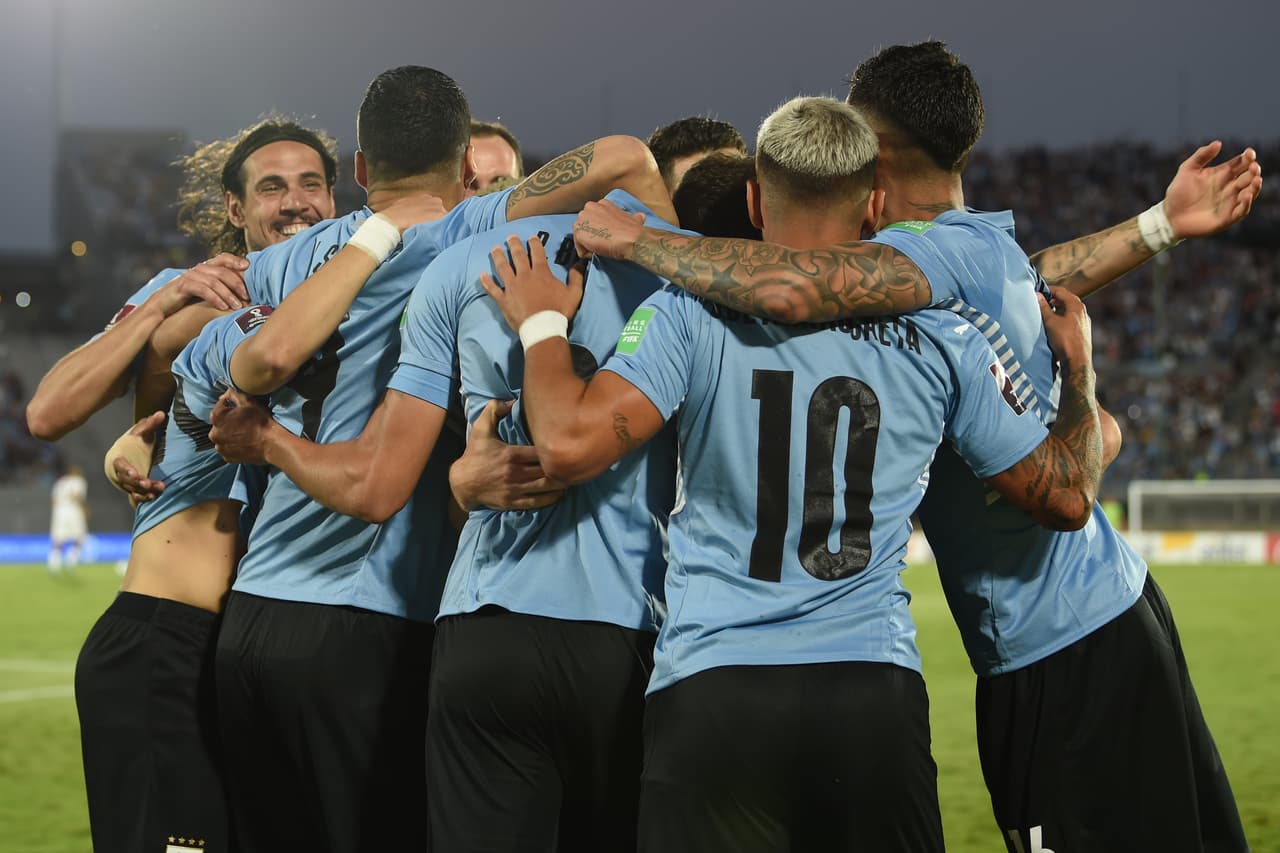 MONTEVIDEO, URUGUAY - FEBRUARY 01: Rodrigo Bentancur of Uruguay celebrates with teammates after scoring the opening goal during a match between Uruguay and Venezuela as part of FIFA World Cup Qatar 2022 Qualifiers at Centenario Stadium on February 01, 2022 in Montevideo, Uruguay. (Photo by Pablo Porciuncula - Pool/Getty Images)