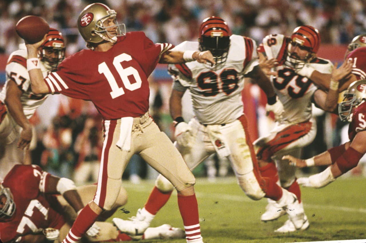 Quarterback - Joe Montana (San Francisco 49ers) [Super Bowls XVI (Ganador-MVP), XIX (Ganador-MVP), XXIII (Ganador), XXIV (Ganador-MVP)]
