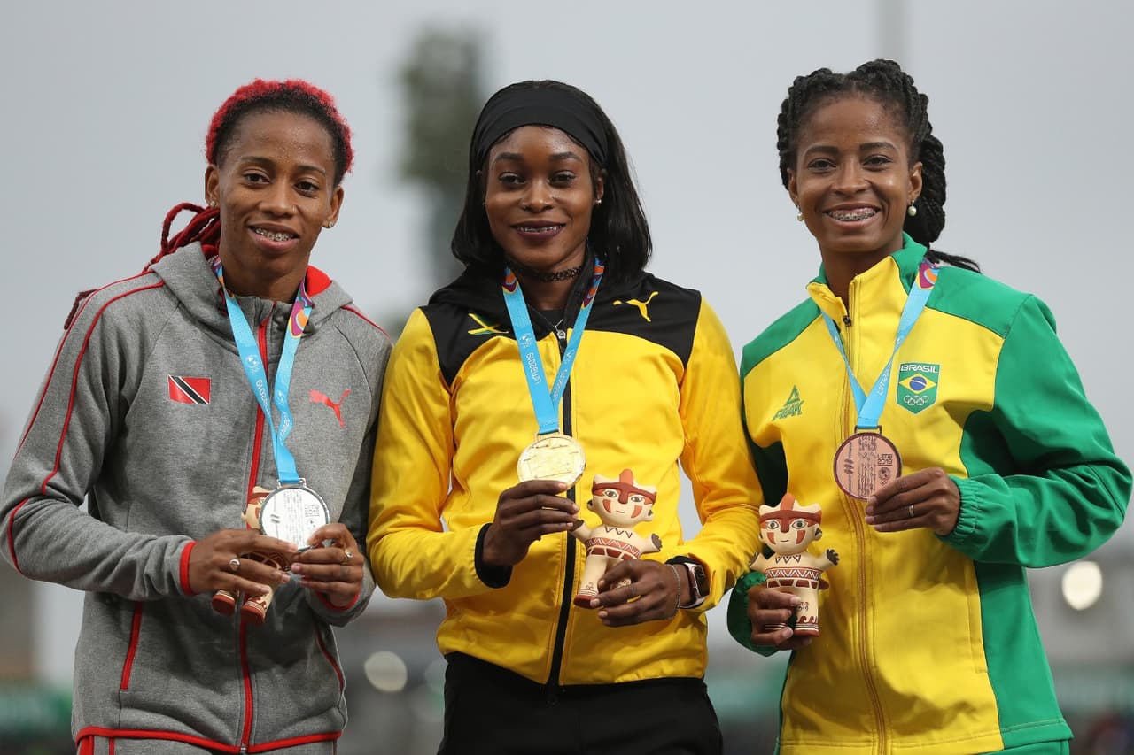 El podio de los 100 m. planos con la campeona olímpica Elaine Thompson con el oro de Lima 2019.