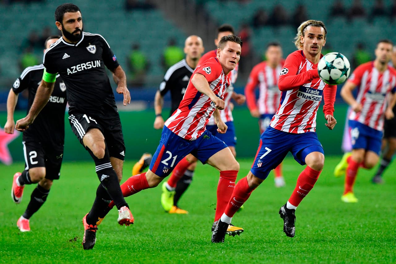 From L: Qarabag's defender from Azerbaijan Rashad Sadygov, Atletico Madrid's forward from France Kevin Gameiro and Atletico Madrid's forward from France Antoine Griezmann vie for the ball during the UEFA Champions League Group C football match between Qarabag FK and Club Atletico de Madrid in Baku on October 18, 2017. / AFP PHOTO / Alexander NEMENOV (Photo credit should read ALEXANDER NEMENOV/AFP/Getty Images)