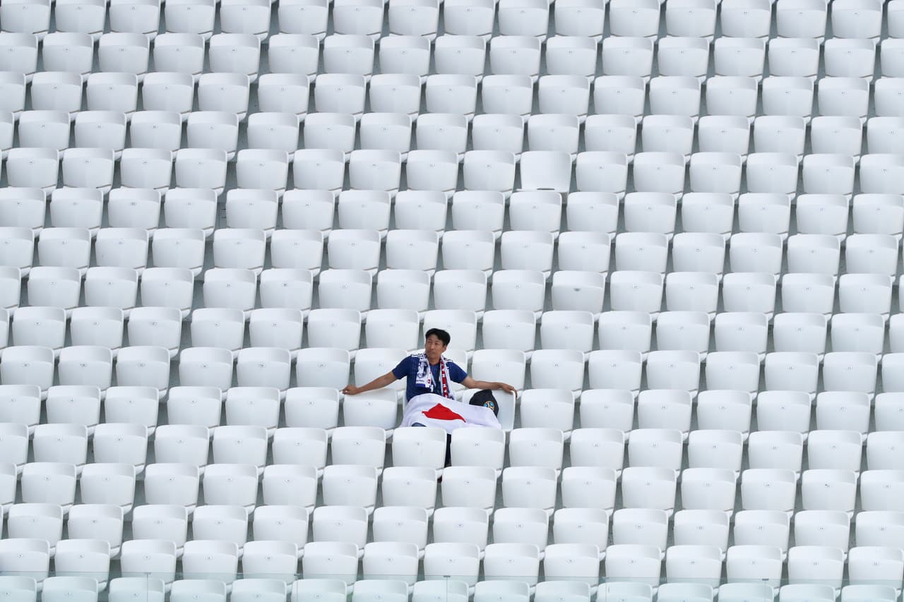 A lone fan of the Japan team waits for the start of the group H match between Japan and Poland at the 2018 soccer World Cup at the Volgograd Arena in Volgograd, Russia, Thursday, June 28, 2018. (AP Photo/Eugene Hoshiko)