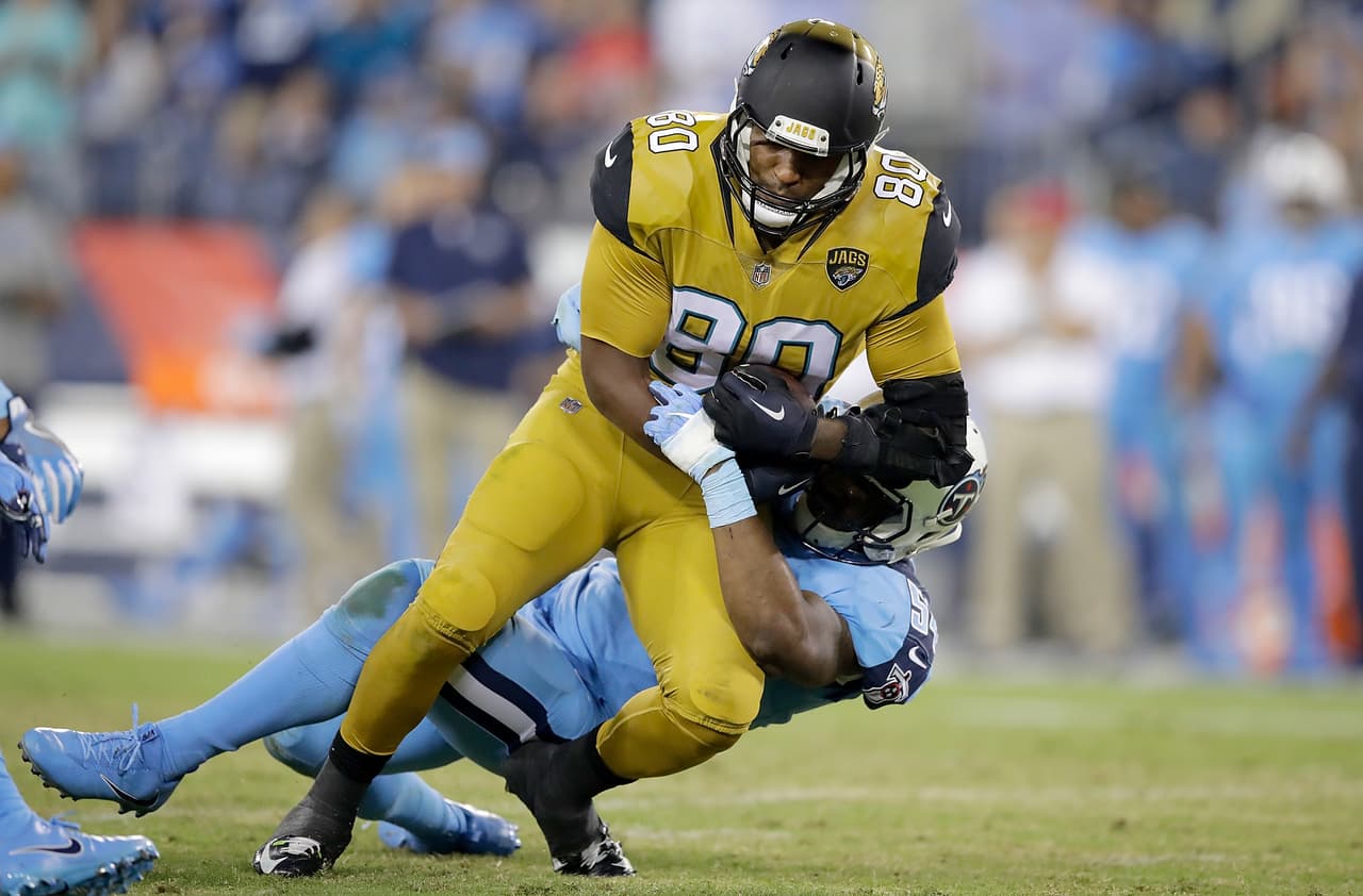 NASHVILLE, TN - OCTOBER 27: Julius Thomas #80 of the Jacksonville Jaguars is tackled by Avery Williamson #54 of the Tennessee Titans during the third quarter of the game at Nissan Stadium on October 27, 2016 in Nashville, Tennessee. (Photo by Andy Lyons/Getty Images)