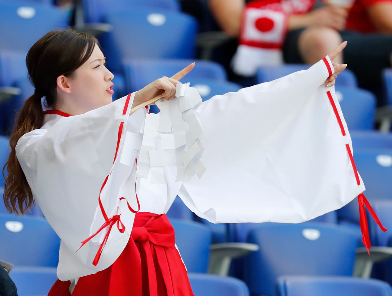 A supporter of team Japan waits for the start of the group H match between Japan and Poland at the 2018 soccer World Cup at the Volgograd Arena in Volgograd, Russia, Thursday, June 28, 2018. (AP Photo/Eugene Hoshiko)