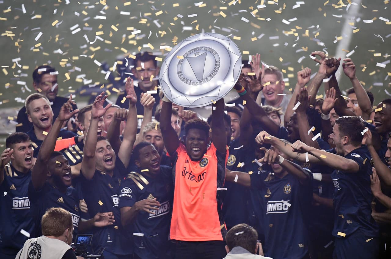 Nov 8, 2020; Chester, Pennsylvania, USA; Philadelphia Union goalkeeper Andre Blake (18) lifts up the Supporters' Shield after defeating the New England Revolution at Subaru Park. Mandatory Credit: Eric Hartline-USA TODAY Sports