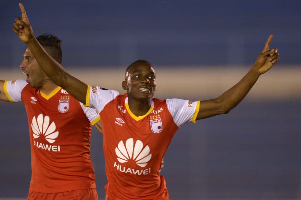 Colombia`s Santa Fe player Dairon Mosquera Chaverra (R) celebrates his goal against Ecuador's Fuerza Amarilla during their 2017 Copa Sudamericana football match at the Estadio Modelo Alberto Spenser Herrera in Guayaquil, Ecuador on June 27, 2017. / AFP PHOTO / Rodrigo BUENDIA (Photo credit should read RODRIGO BUENDIA/AFP/Getty Images)