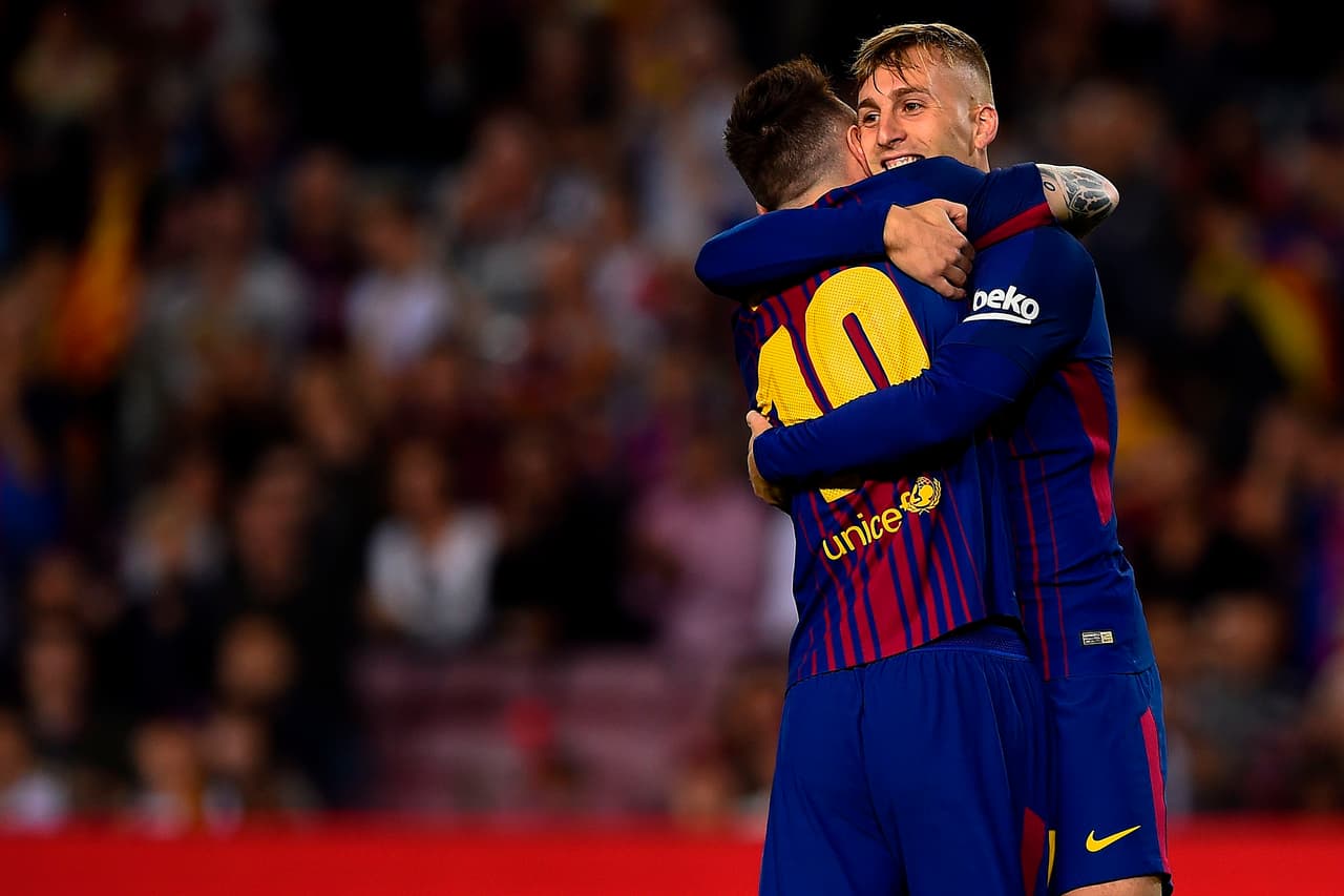 Barcelona's forward Gerard Deulofeu (R) celebrates with Barcelona's Argentinian forward Lionel Messi after scoring a goal during the Spanish league football match FC Barcelona vs Malaga CF at the Camp Nou stadium in Barcelona on October 21, 2017. / AFP PHOTO / Josep LAGO (Photo credit should read JOSEP LAGO/AFP/Getty Images)