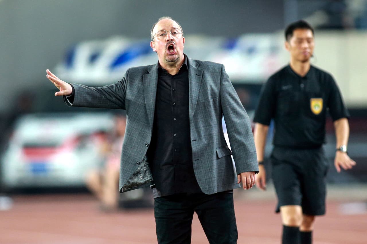 Dalian Yifang's new head coach Rafael Benitez (L) gestures during the Chinese Super League (CSL) football match between Dalian Yifang and Henan Jianye in Dalian in northeast China's Liaoning province on July 7, 2019. (Photo by STR / AFP) / China OUT (Photo credit should read STR/AFP/Getty Images)