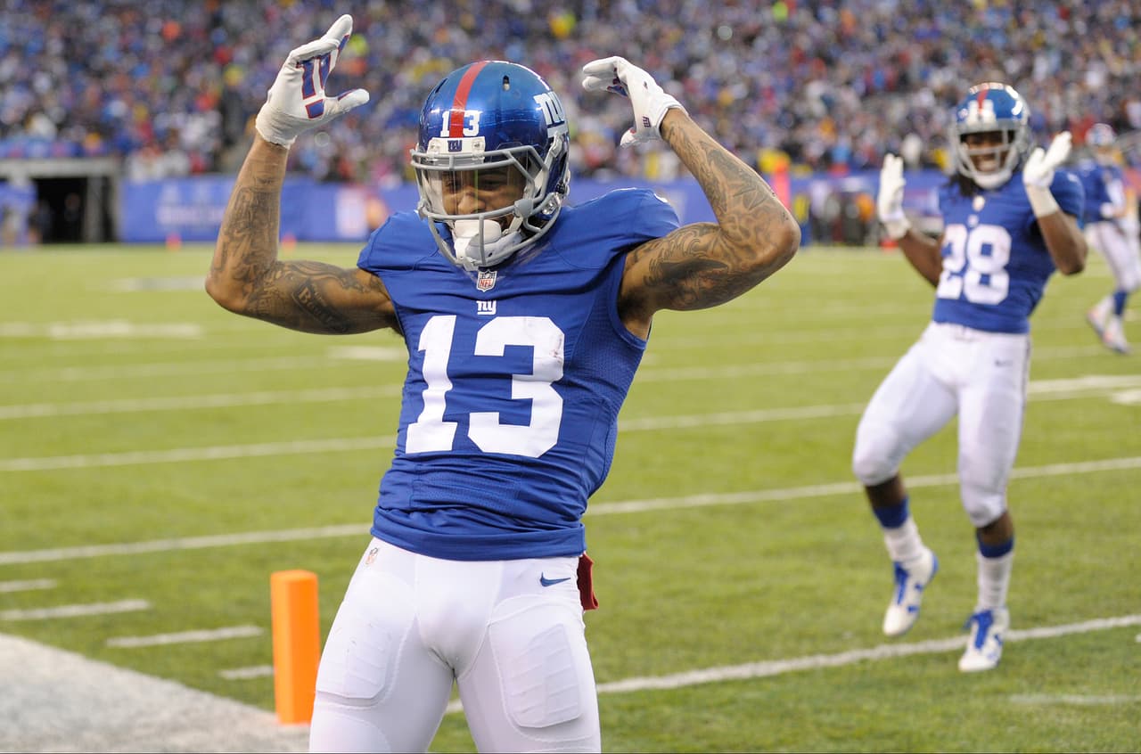 New York Giants wide receiver Odell Beckham (13) celebrates after scoring a touchdown during the second half of an NFL football game against the Detroit Lions Sunday, Dec. 18, 2016, in East Rutherford, N.J. (AP Photo/Bill Kostroun)