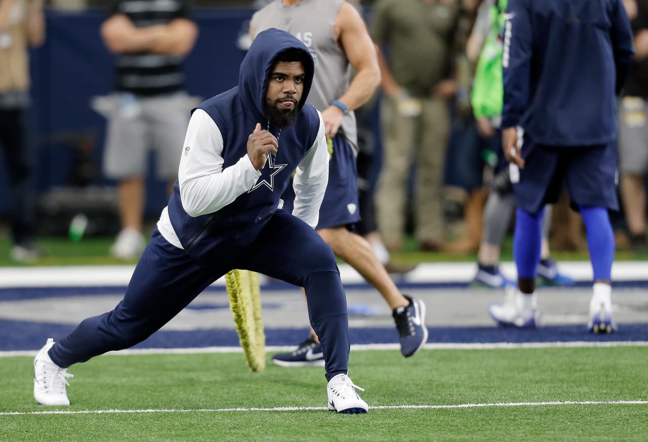 Dallas Cowboys running back Ezekiel Elliott (21) warms up before an NFL football game against the Kansas City Chiefs, Sunday, Nov. 5, 2017, in Arlington, Texas. (AP Photo/Brandon Wade)