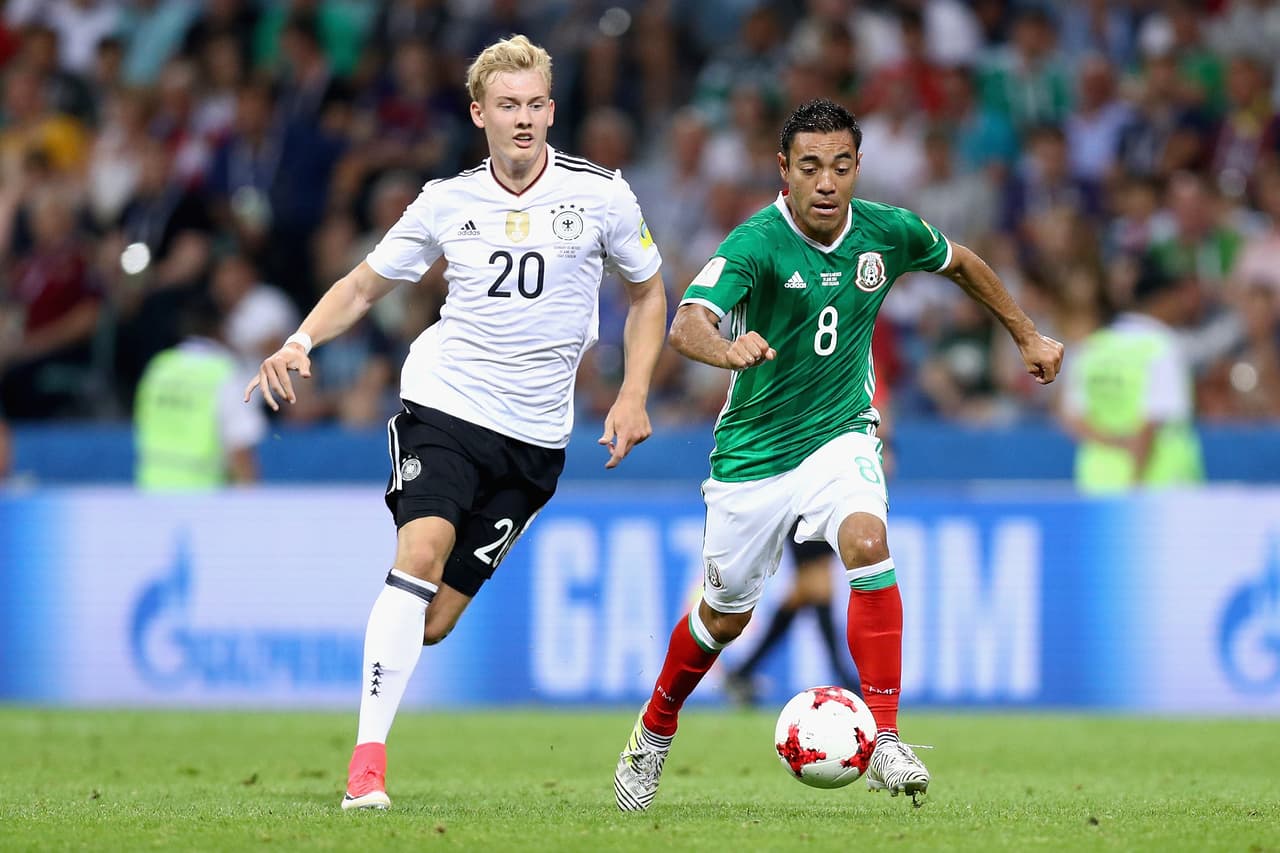 SOCHI, RUSSIA - JUNE 29: Marco Fabian of Mexico and Julian Brandt of Germany compete for the ball during the FIFA Confederations Cup Russia 2017 Semi-Final between Germany and Mexico at Fisht Olympic Stadium on June 29, 2017 in Sochi, Russia. (Photo by Buda Mendes/Getty Images)