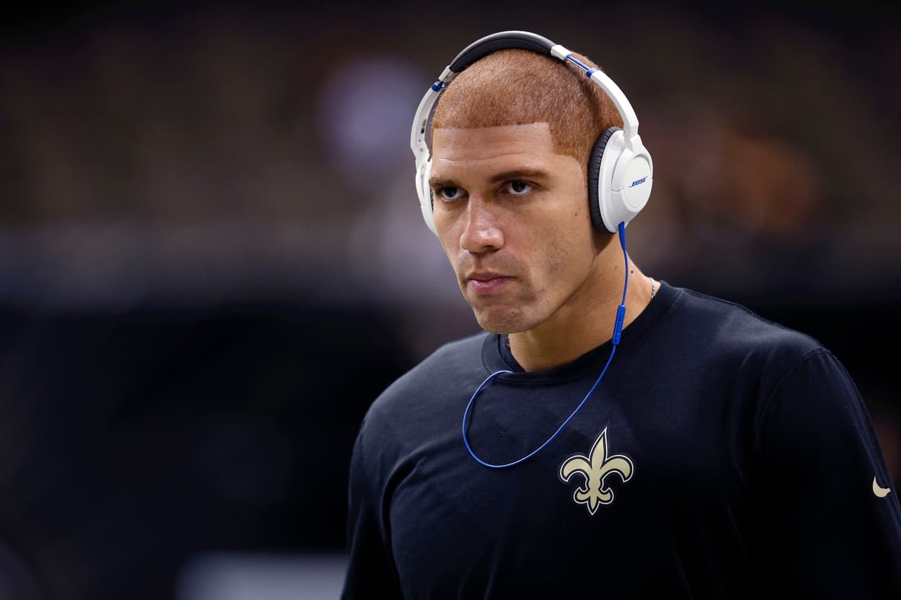 New Orleans Saints tight end Jimmy Graham warms up with Bose headphones before an NFL football game against the Green Bay Packers in New Orleans, Sunday, Oct. 26, 2014. (AP Photo/Bill Haber)