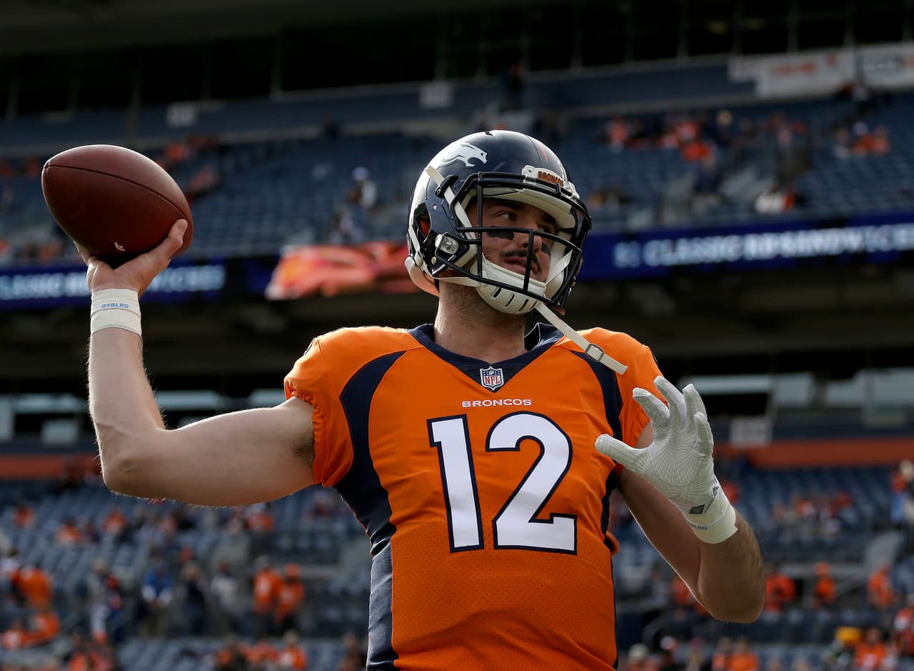 Denver Broncos quarterback Paxton Lynch (12) warms up prior to an NFL football game against the Cincinnati Bengals, Sunday, Nov. 19, 2017, in Denver. (AP Photo/Jack Dempsey)
