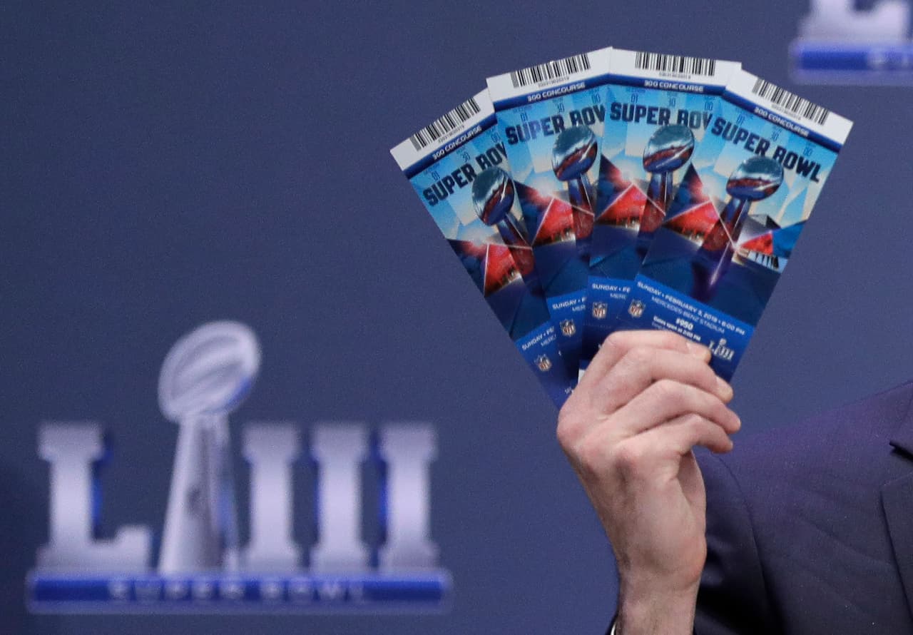 Michael, Buchwald, NFL Senior Counsel, Legal, holds up Super Bowl 53 tickets as he explains the security features on the tickets during a news conference for the NFL Super Bowl 53 football game Thursday, Jan. 31, 2019, in Atlanta. (AP Photo/David J. Phillip)