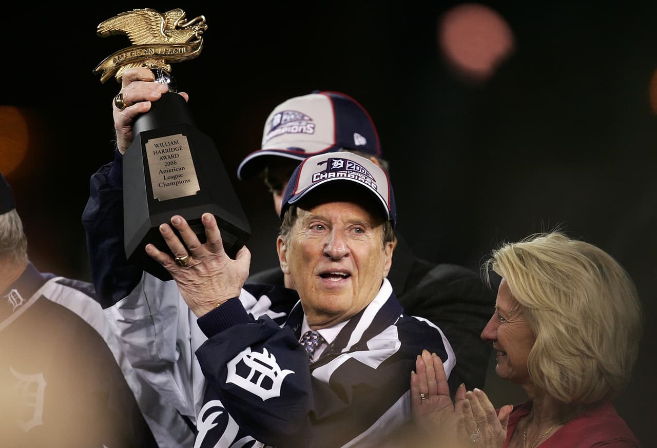 DETROIT - OCTOBER 14: Michael Ilitch, owner of the Detroit Tigers celebrates with the AMerican League Championship trophy after the Tigers won 6-3 against the Oakland Athletics during Game Four of the American League Championship Series October 14, 2006 at Comerica Park in Detroit, Michigan. With the win the Tigers advanced to the World Series. (Photo by Jonathan Daniel/Getty Images)