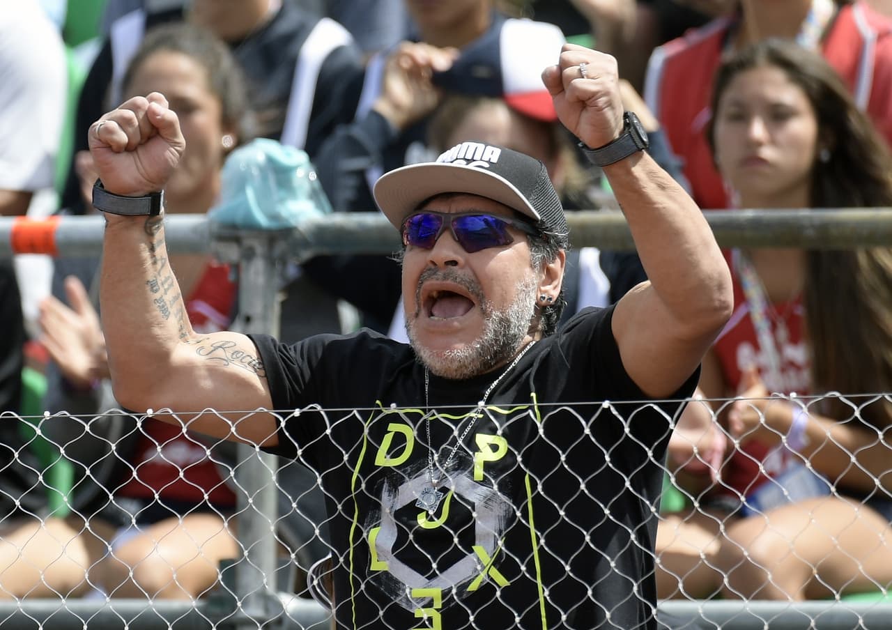 Argentina's former footballer Diego Maradona cheers during the 2017 Davis Cup World Group first round single tennis match between Argentina's tennis player Guido Pella and Italy's Fabio Fognini at Parque Sarmiento stadium in Buenos Aires on February 6, 2017. / AFP / JUAN MABROMATA (Photo credit should read JUAN MABROMATA/AFP/Getty Images)
