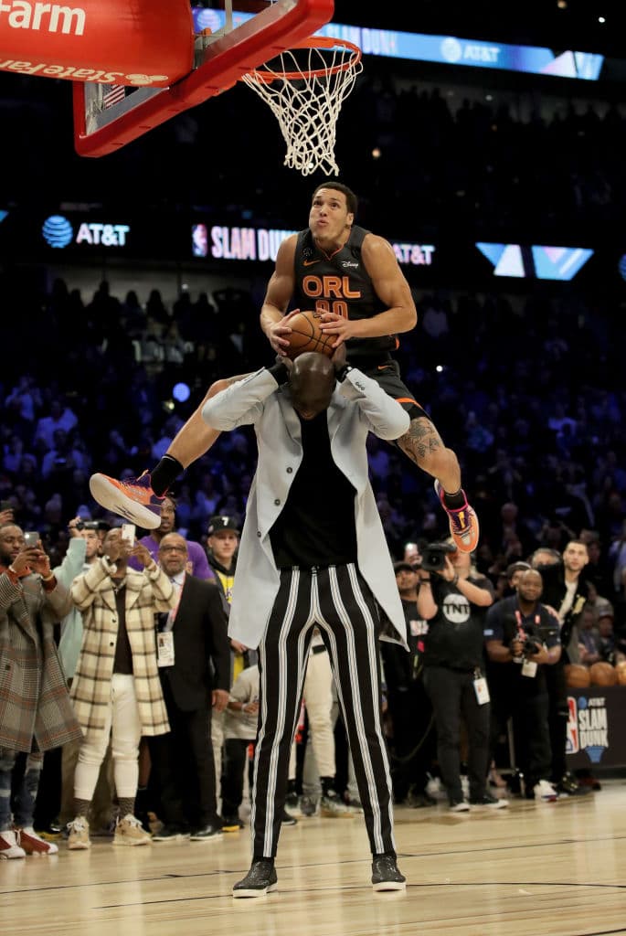 CHICAGO, ILLINOIS - FEBRUARY 15: Aaron Gordon #00 of the Orlando Magic dunks the ball over Tacko Fall of the Boston Celtics in the 2020 NBA All-Star - AT&T Slam Dunk Contest during State Farm All-Star Saturday Night at the United Center on February 15, 2020 in Chicago, Illinois. NOTE TO USER: User expressly acknowledges and agrees that, by downloading and or using this photograph, User is consenting to the terms and conditions of the Getty Images License Agreement. (Photo by Jonathan Daniel/Getty Images)