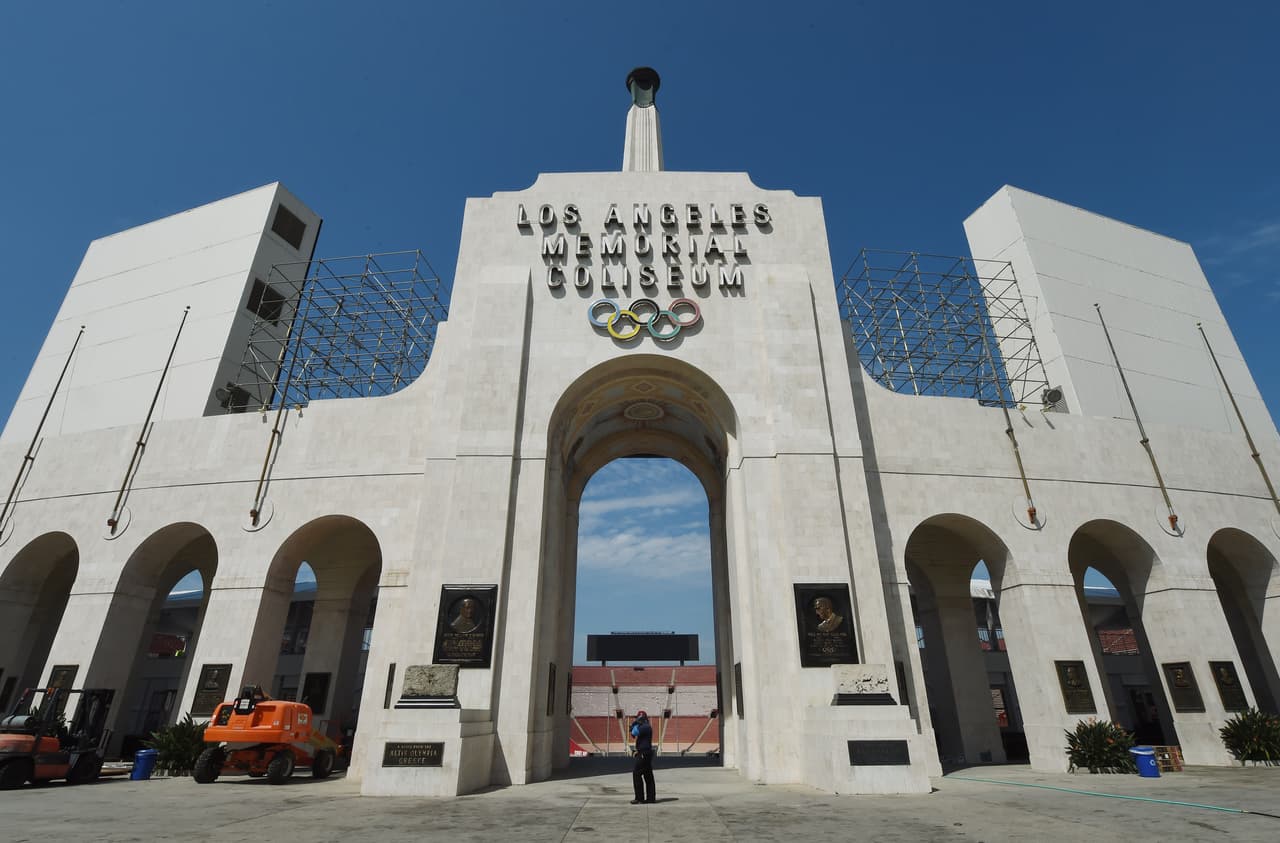 The Los Angeles Memorial Coliseum, venue for two previous Olympic Games, is seen in this on August 26, 2015 in Los Angeles, California. The Coliseum would be renovated and used as the main stadium if the city bids for the 2024 Summer Olympics. The Los Angeles city council is reviewing a $4.1 billion bid proposal for the 2024 Summer Olympics that backers say could produce a surplus of $161 million if the city is awarded a third Summer Games. A 218-page bid book made public on August 25 shows plans for a Los Angeles Games rely on private-sector partners to pay more than $1.7 billion in venue costs and includes revenue projections such as $4.8 billion from ticket sales, broadcast rights and corporate sponsorships. AFP PHOTO / MARK RALSTON (Photo credit should read MARK RALSTON/AFP/Getty Images)