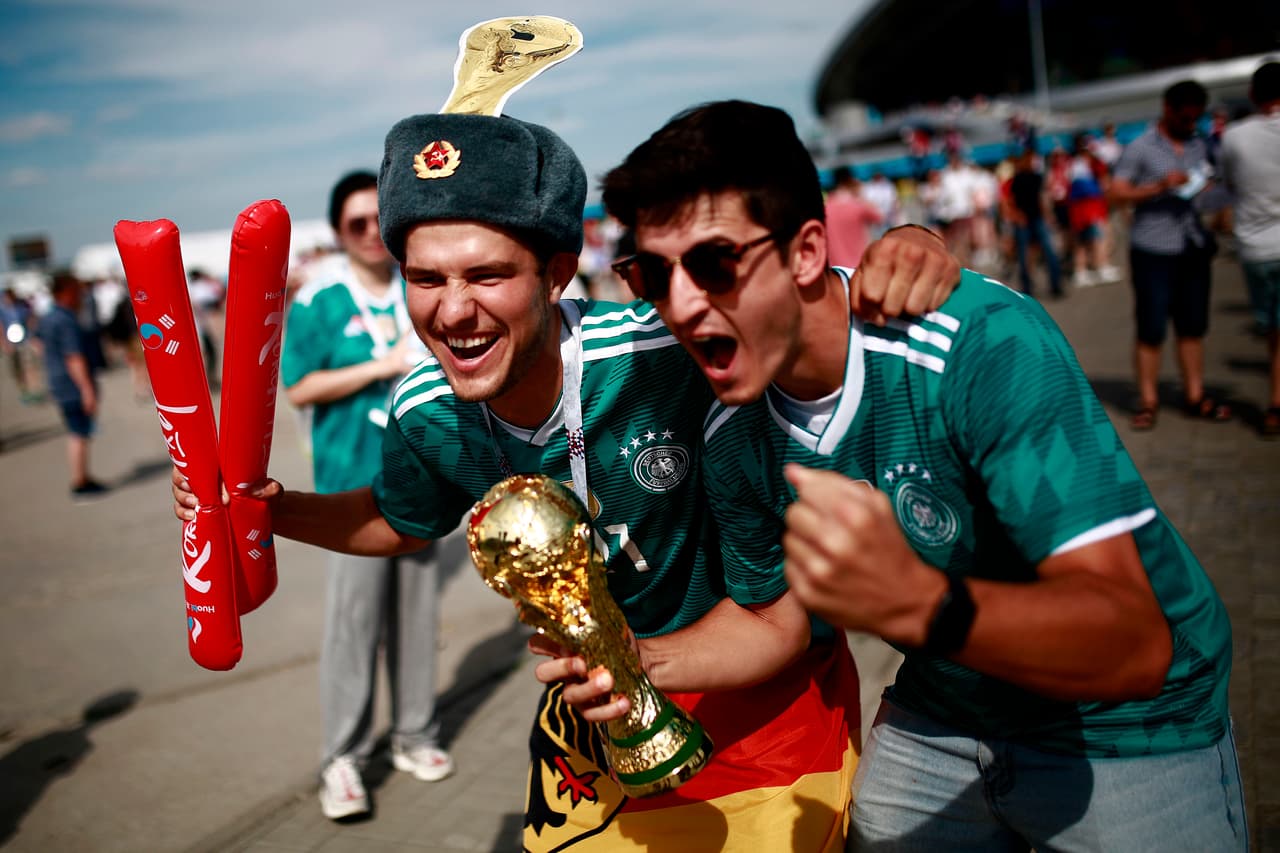 Germany supporters pose for a picture ahead of the Russia 2018 World Cup Group F football match between South Korea and Germany at the Kazan Arena in Kazan on June 27, 2018. (Photo by Benjamin CREMEL / AFP) / RESTRICTED TO EDITORIAL USE - NO MOBILE PUSH ALERTS/DOWNLOADS (Photo credit should read BENJAMIN CREMEL/AFP/Getty Images)