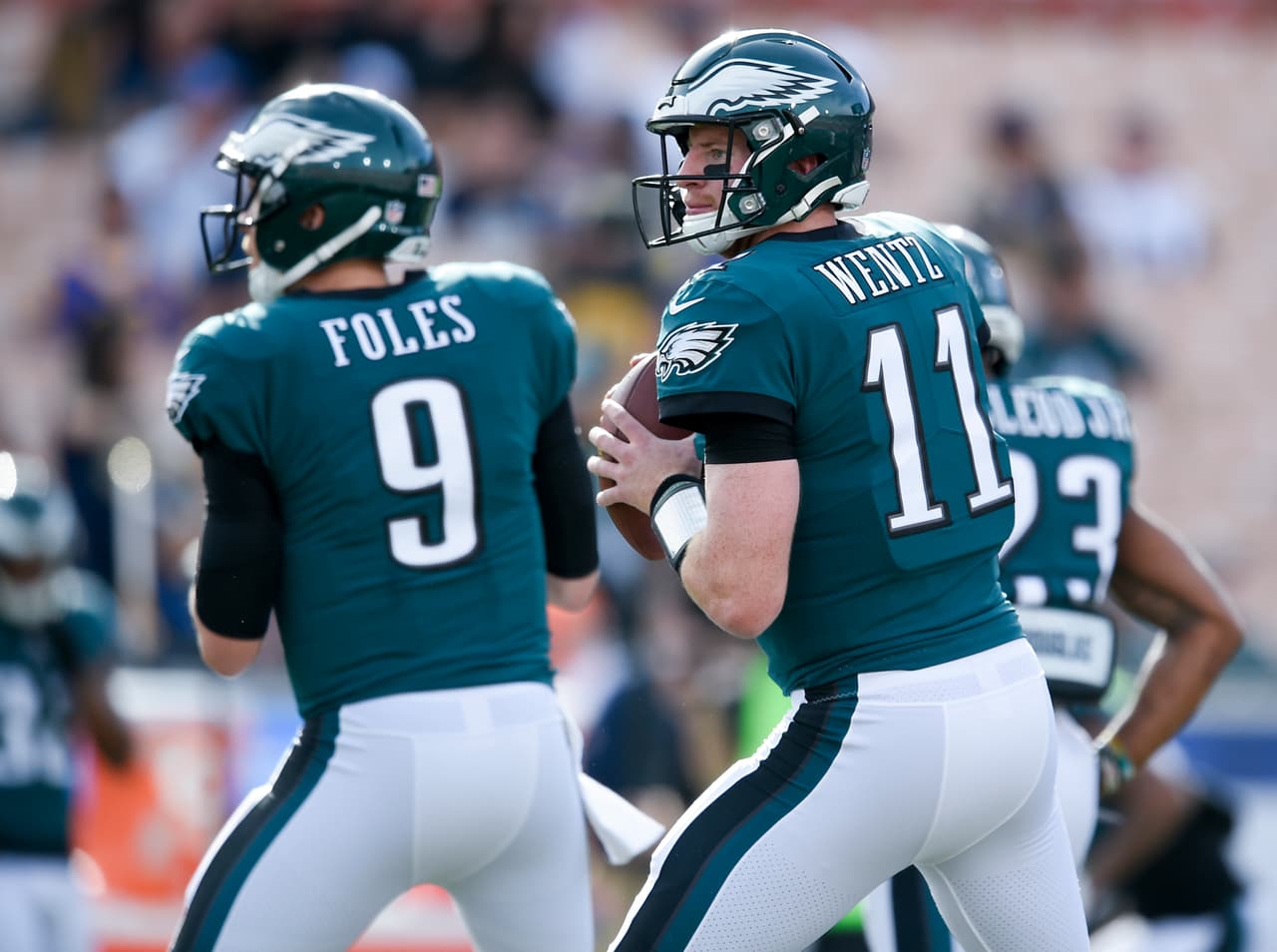 Philadelphia Eagles quarterback Carson Wentz, right, and quarterback Nick Foles warm up before an NFL football game against the Los Angeles Rams Sunday, Dec. 10, 2017, in Los Angeles. (AP Photo/Kelvin Kuo)