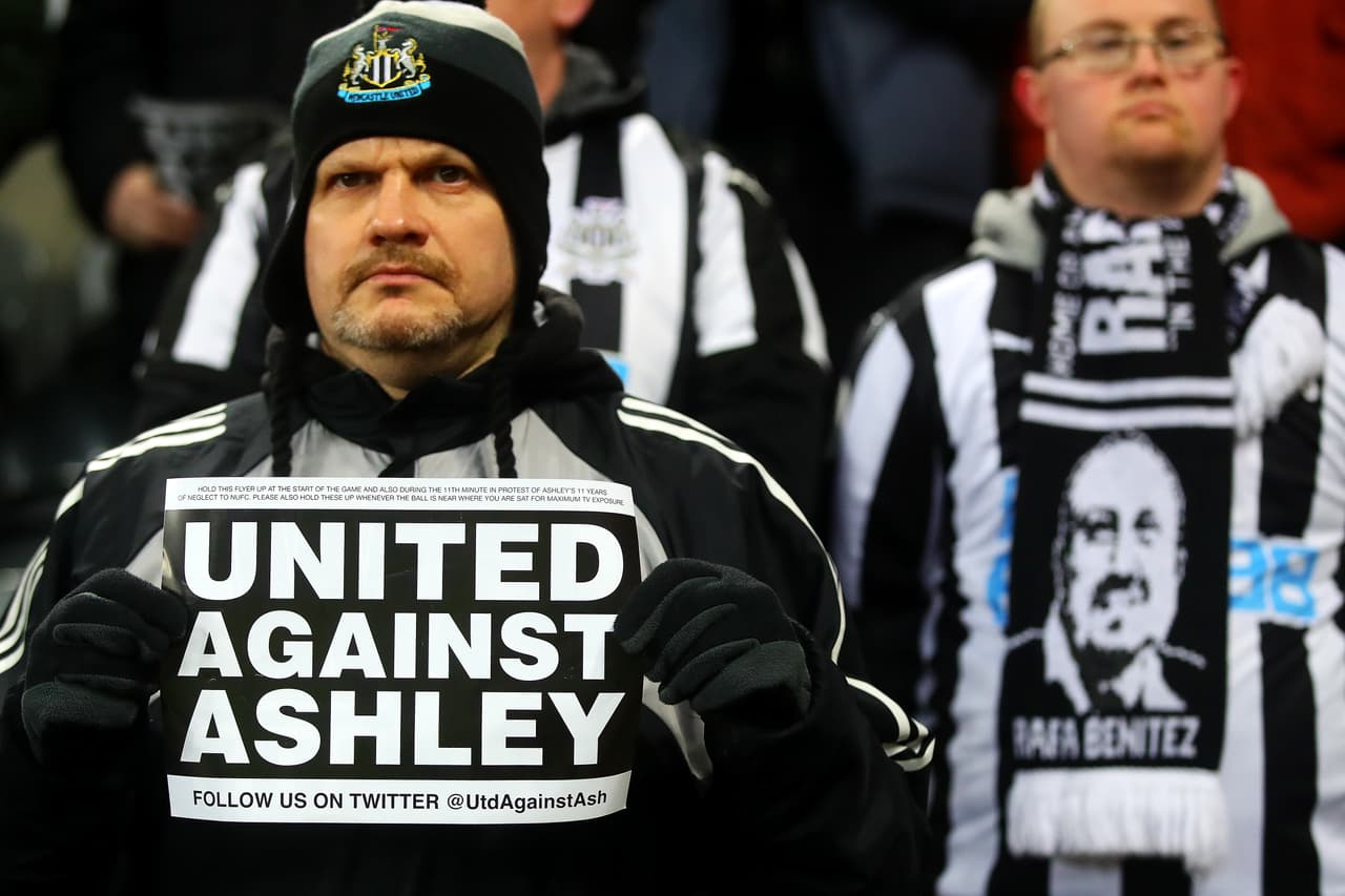 NEWCASTLE UPON TYNE, ENGLAND - JANUARY 29: A Newcastle United fan holds up a Mike Ashley banner during the Premier League match between Newcastle United and Manchester City at St. James Park on January 29, 2019 in Newcastle upon Tyne, United Kingdom. (Photo by Chris Brunskill/Fantasista/Getty Images)