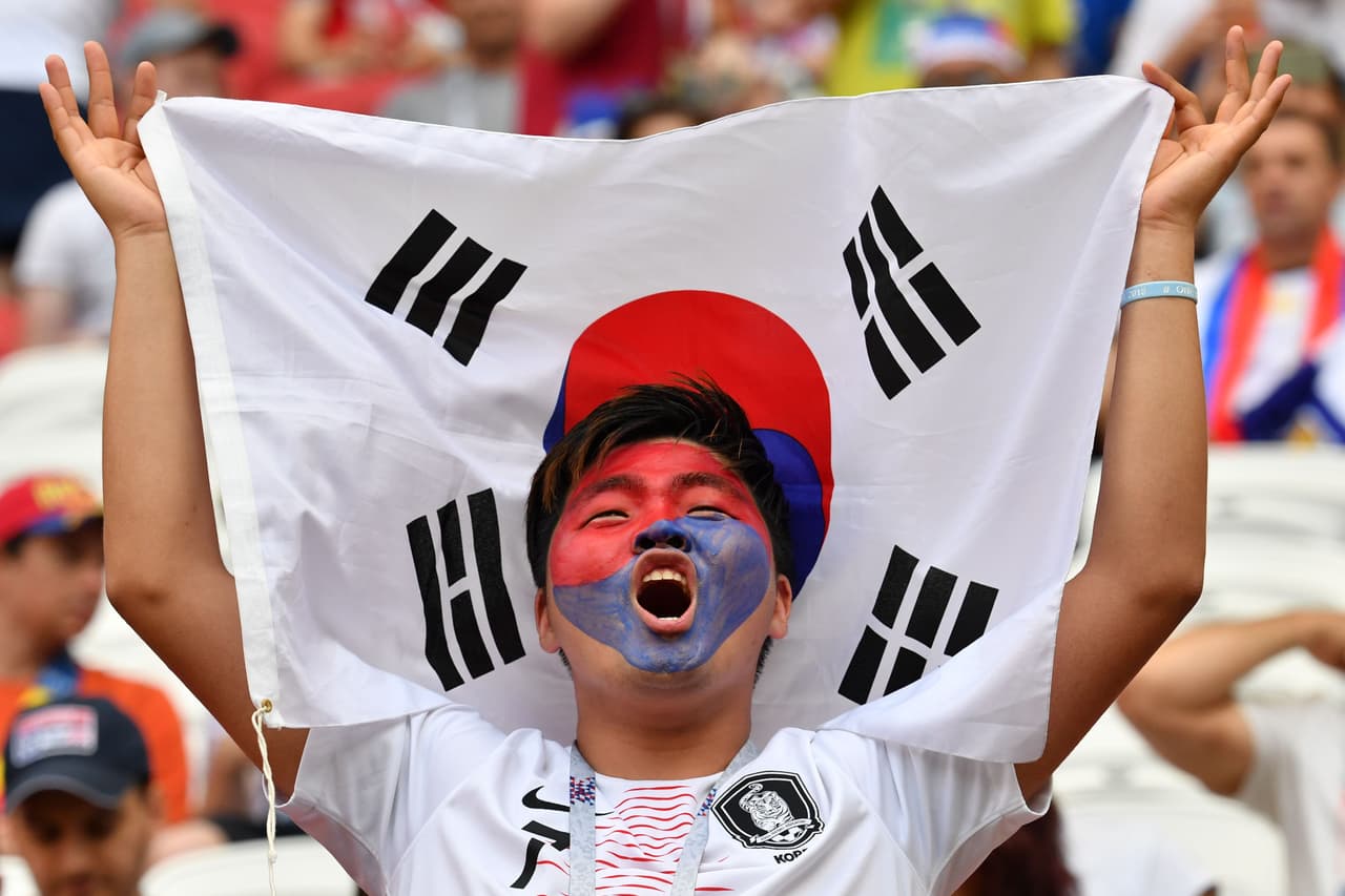 South Korea's fan cheers prior to the Russia 2018 World Cup Group F football match between South Korea and Germany at the Kazan Arena in Kazan on June 27, 2018. (Photo by SAEED KHAN / AFP) / RESTRICTED TO EDITORIAL USE - NO MOBILE PUSH ALERTS/DOWNLOADS (Photo credit should read SAEED KHAN/AFP/Getty Images)