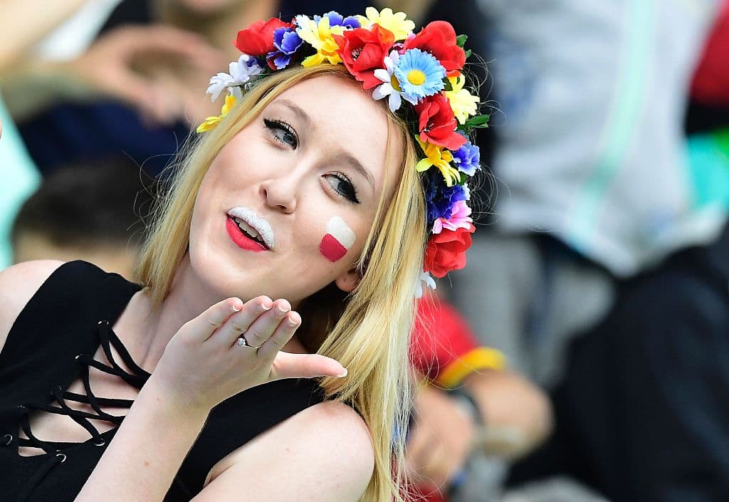A Poland supporter blows a kiss during the Euro 2016 round of sixteen football match Switzerland vs Poland, on June 25, 2016 at the Geoffroy Guichard stadium in Saint-Etienne. / AFP / TOBIAS SCHWARZ (Photo credit should read TOBIAS SCHWARZ/AFP/Getty Images)